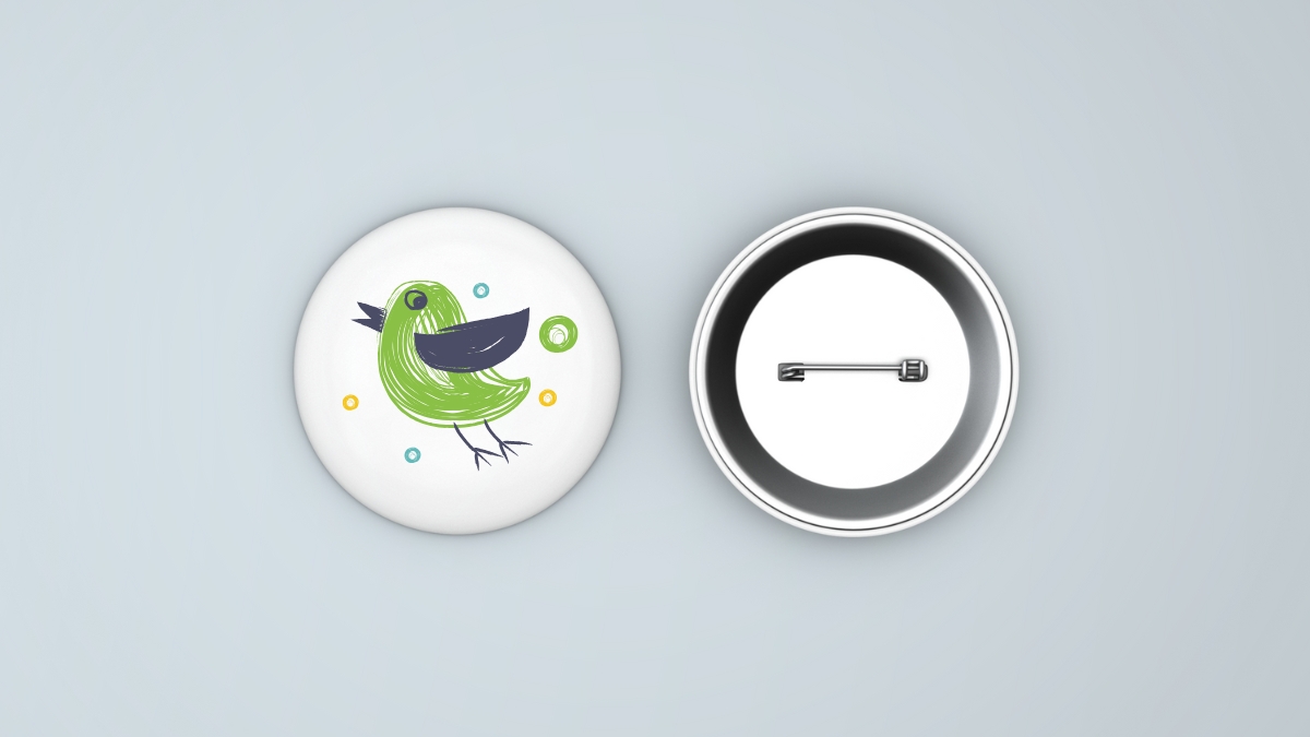 Pin back button with image of bird on it