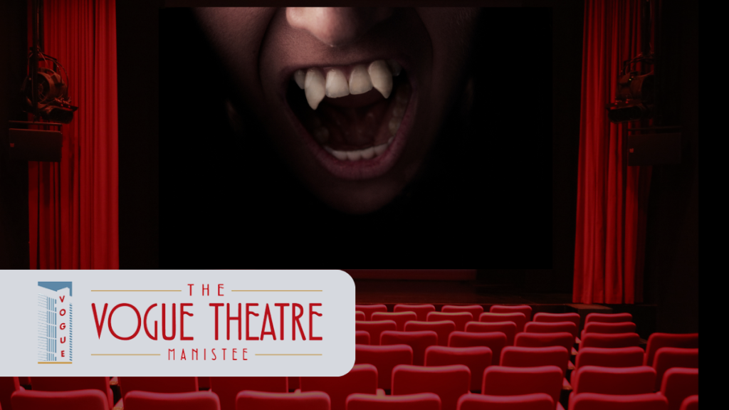 movie theater screen with The Vogue Theatre Manistee logo
