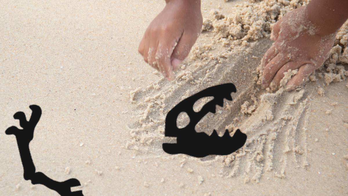 hands in sand, dinosaur head and arm bone graphic