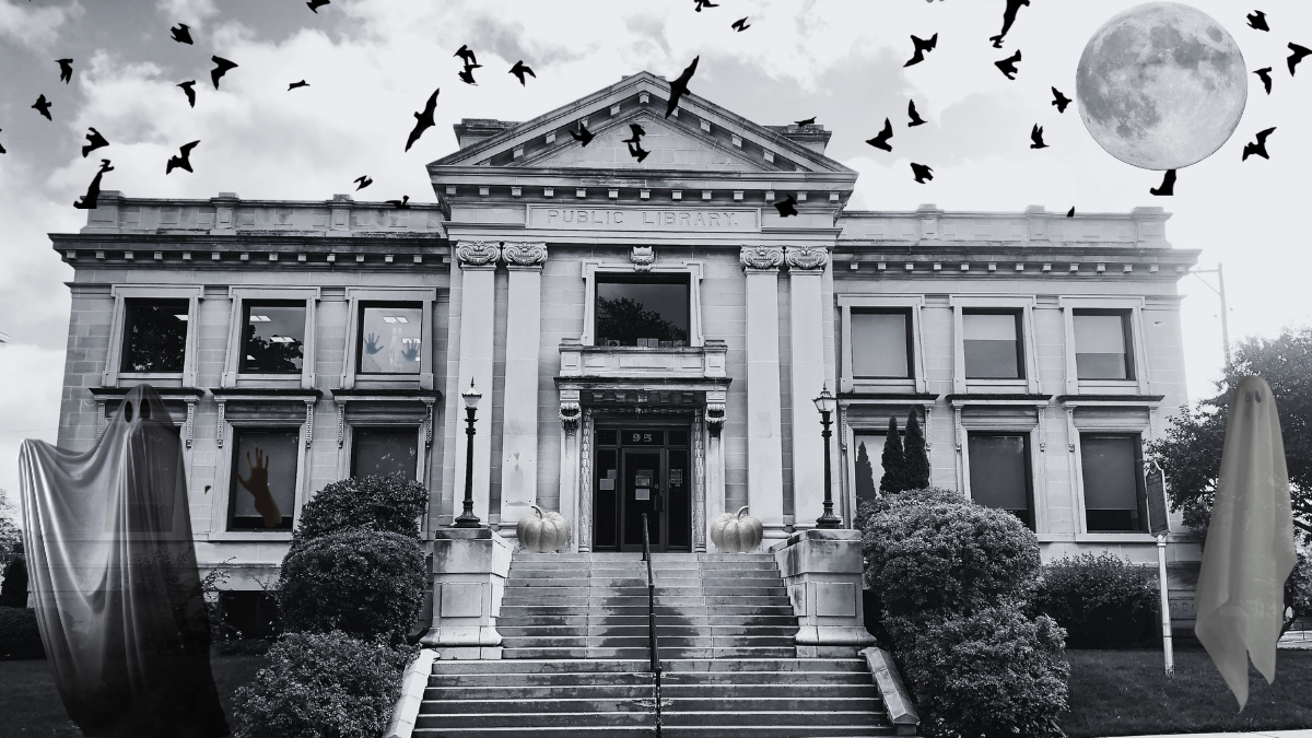 front of Manistee library with ghosts, bats and full moon